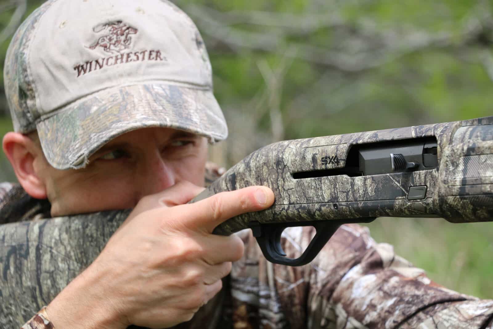 Turkey Hunter Takes Aim At Gobbler